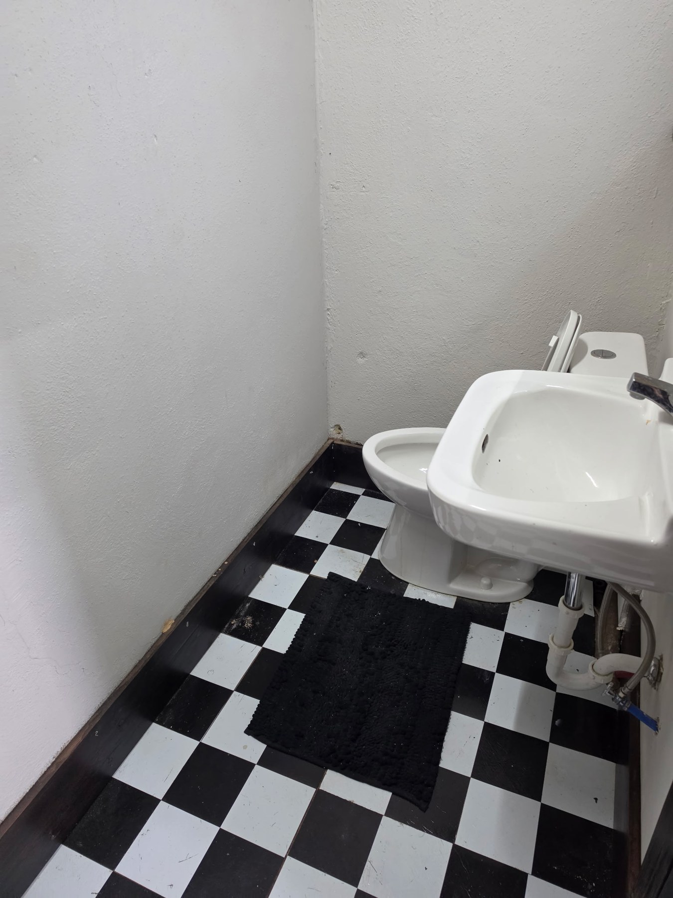 Bathroom with checkerboard floor