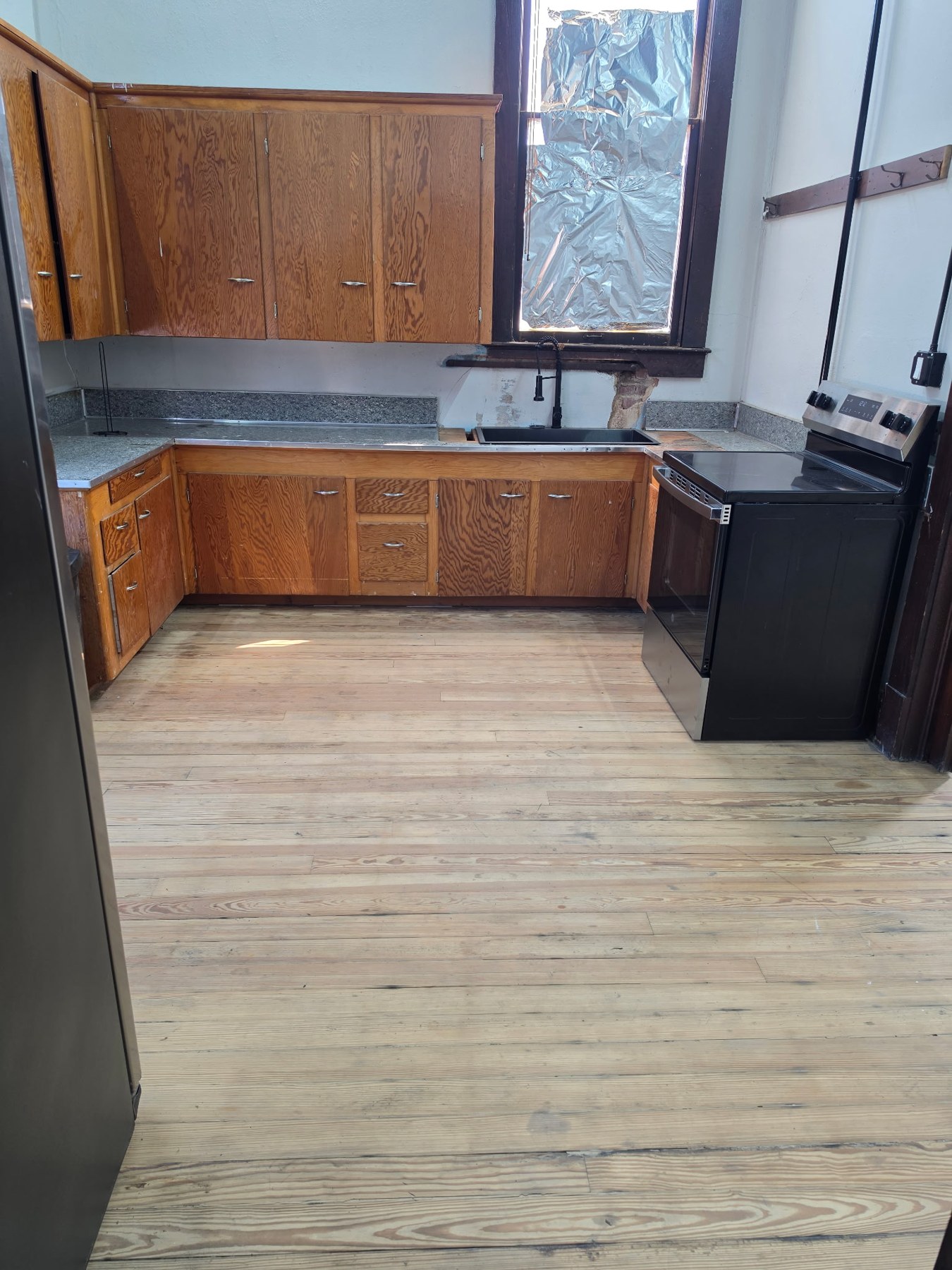 Kitchen with wood cabinetry and range